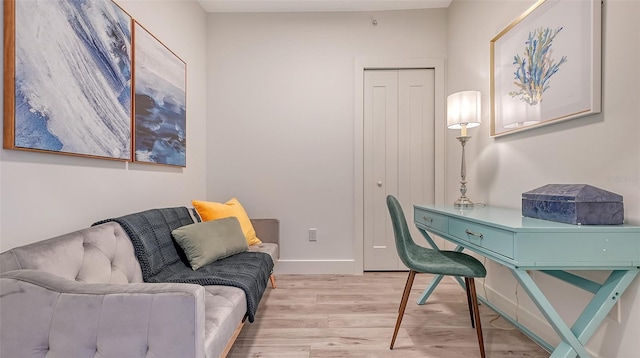 office area with light wood-type flooring and baseboards