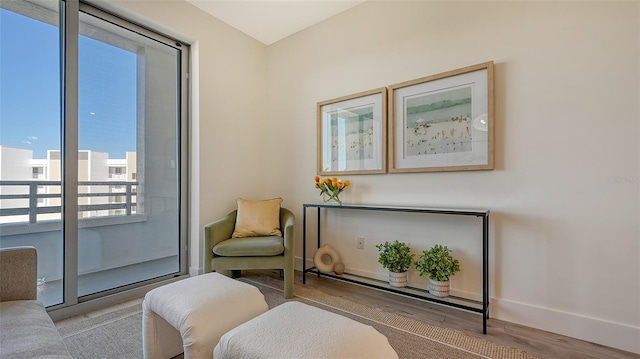 sitting room with light hardwood / wood-style floors