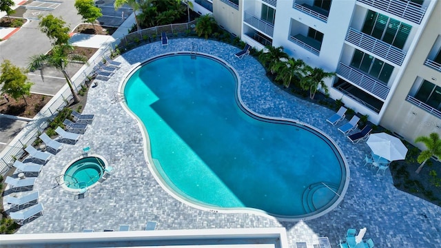 view of pool featuring a hot tub