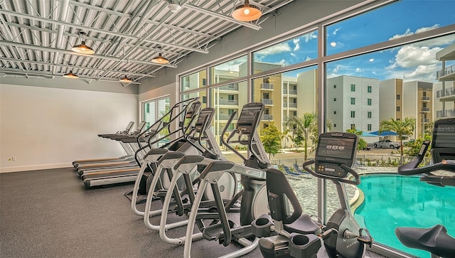 workout area featuring baseboards