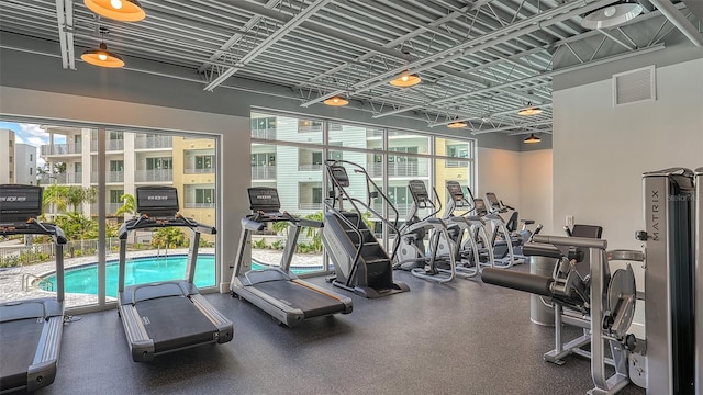 gym with a wealth of natural light and visible vents