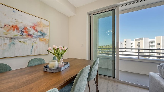 dining space featuring light wood-style floors