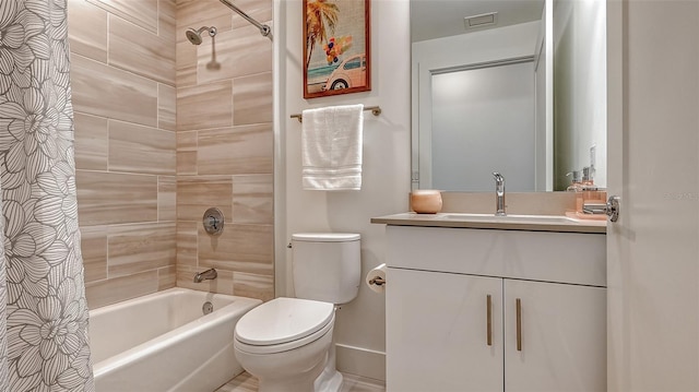 full bathroom featuring toilet, visible vents, vanity, and shower / bathtub combination with curtain