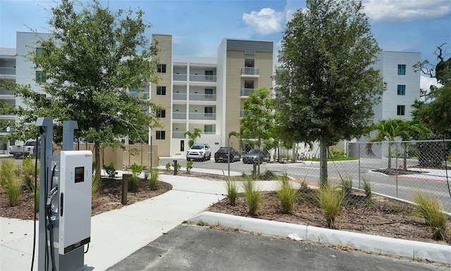 view of property's community featuring fence