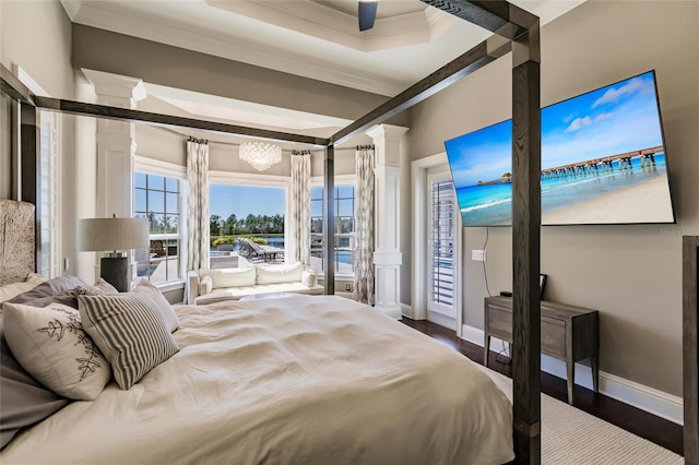 bedroom with access to exterior, ornamental molding, a notable chandelier, and hardwood / wood-style flooring