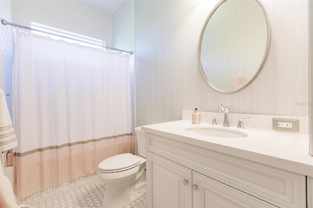 bathroom with tile patterned floors, vanity, and toilet