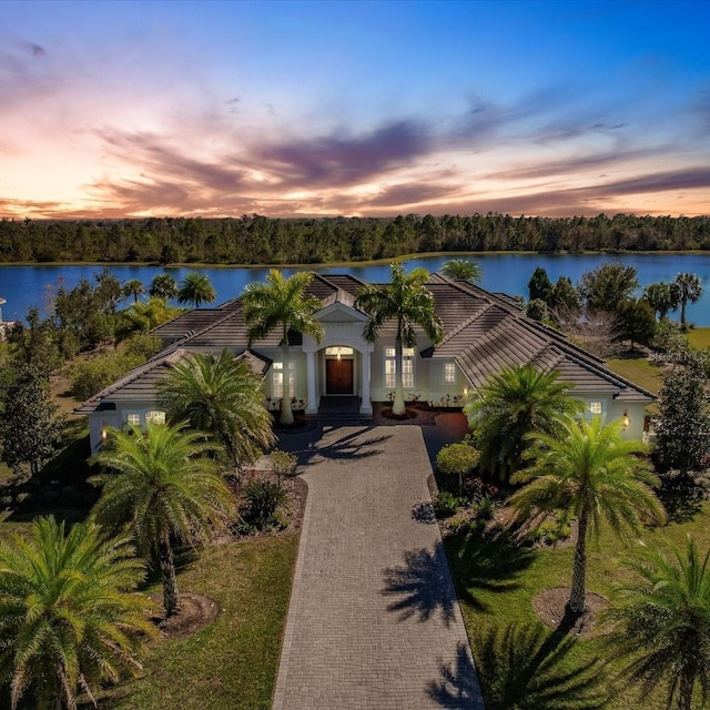 view of front of home with a water view