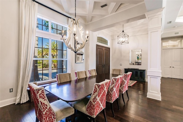 dining area featuring ornate columns, coffered ceiling, crown molding, beam ceiling, and dark hardwood / wood-style floors