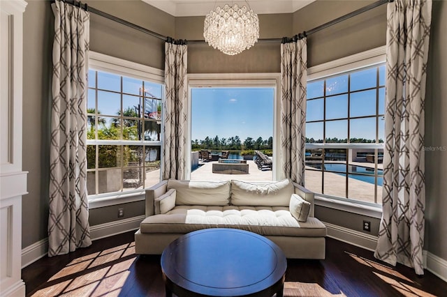 living area with hardwood / wood-style floors and a chandelier