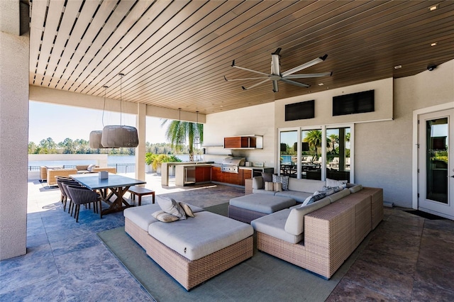 view of patio featuring area for grilling and ceiling fan