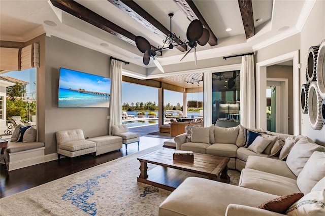 living room featuring ceiling fan, dark hardwood / wood-style flooring, and crown molding