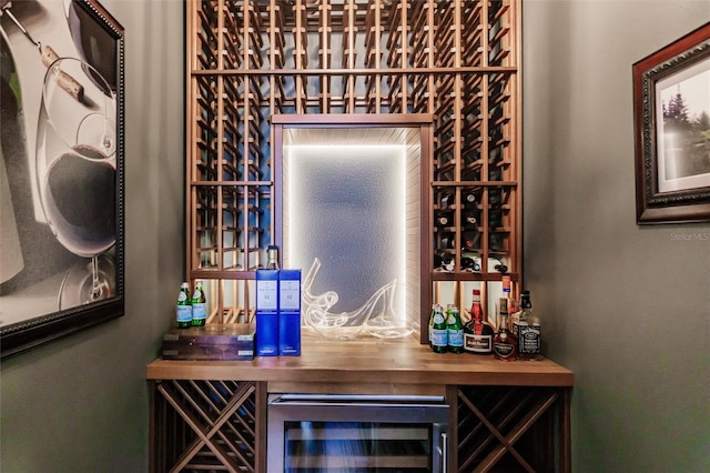 wine cellar featuring indoor bar and wine cooler