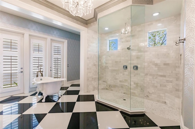 bathroom with separate shower and tub, crown molding, and a notable chandelier