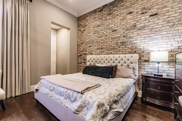 bedroom with brick wall, dark hardwood / wood-style floors, and ornamental molding