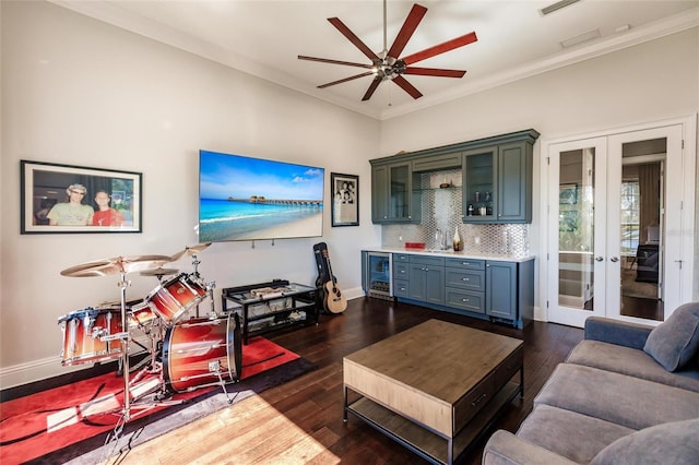 living room featuring french doors, crown molding, dark hardwood / wood-style floors, ceiling fan, and beverage cooler