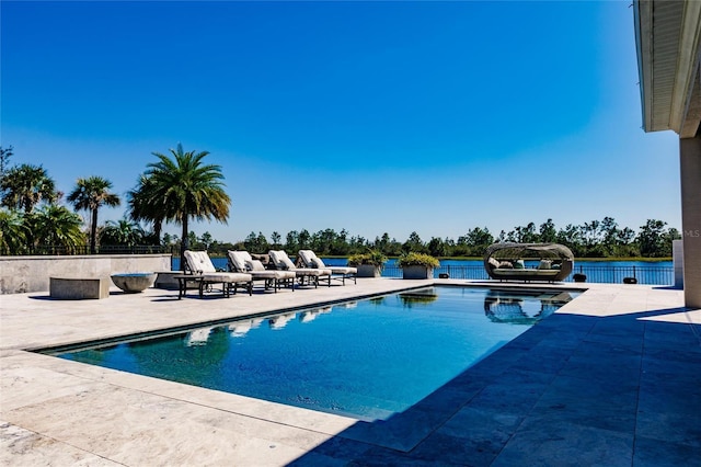 view of pool featuring a jacuzzi and a patio