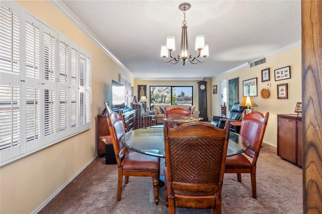 carpeted dining area featuring a textured ceiling, ornamental molding, baseboards, and a notable chandelier