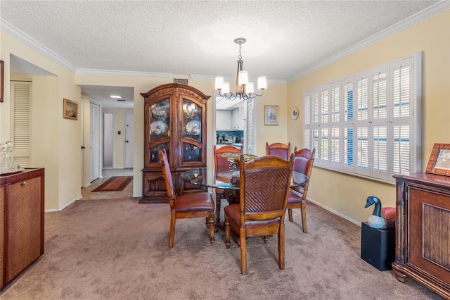 dining area with crown molding, light colored carpet, visible vents, an inviting chandelier, and a textured ceiling