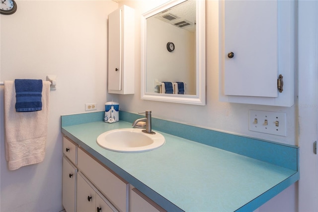 bathroom featuring visible vents and vanity