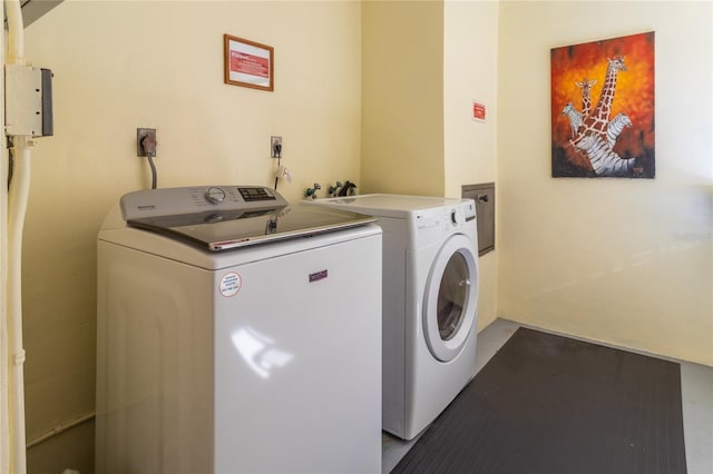 clothes washing area with laundry area and washer and dryer