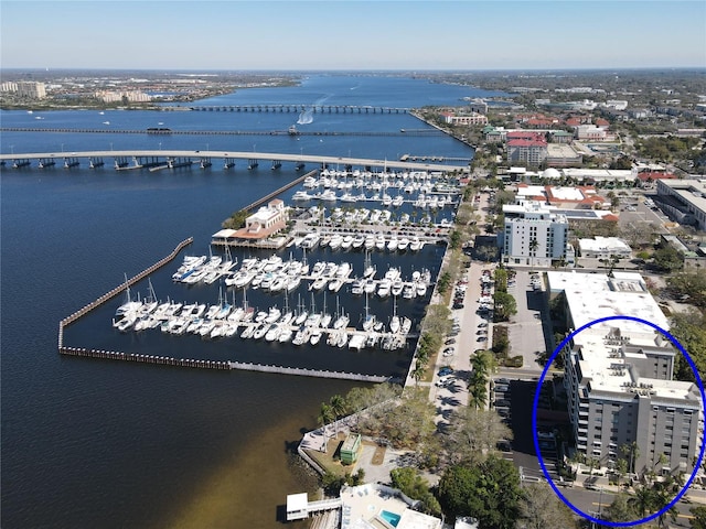 drone / aerial view with a view of city and a water view