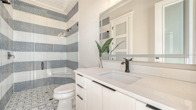 bathroom featuring vanity, toilet, and an enclosed shower