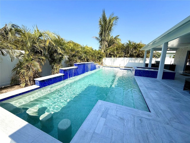 view of pool featuring ceiling fan, a patio area, a fenced backyard, and a fenced in pool