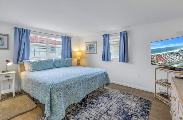 bedroom featuring dark hardwood / wood-style flooring