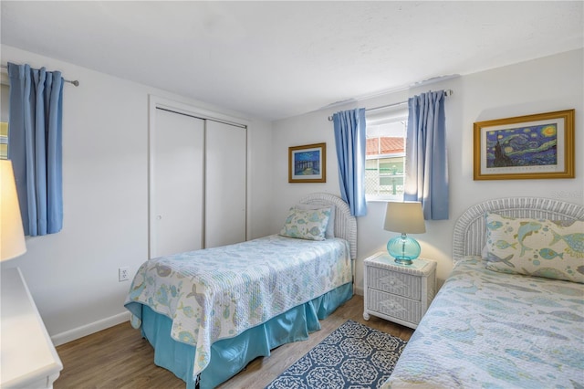 bedroom featuring light hardwood / wood-style floors and a closet