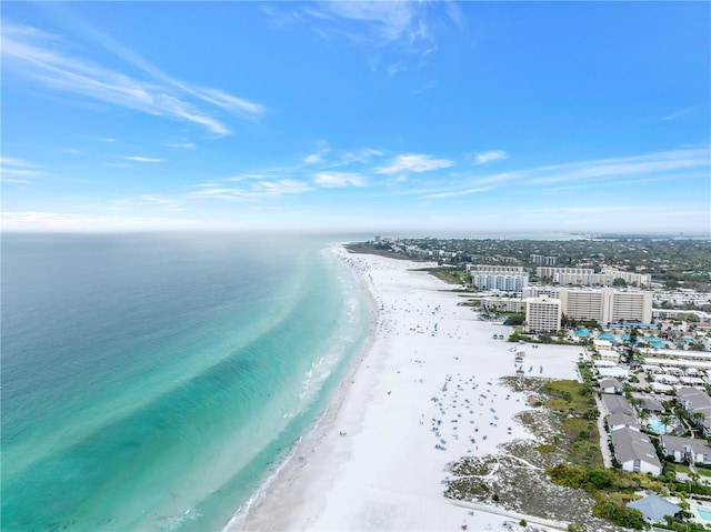 bird's eye view with a beach view and a water view