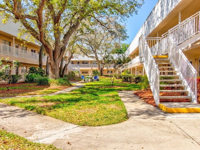 view of home's community featuring a yard