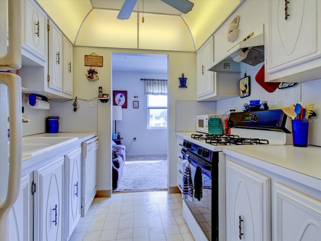 kitchen with white appliances, ventilation hood, ceiling fan, sink, and white cabinets