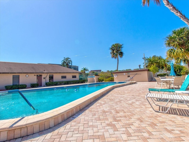 view of swimming pool with a patio area