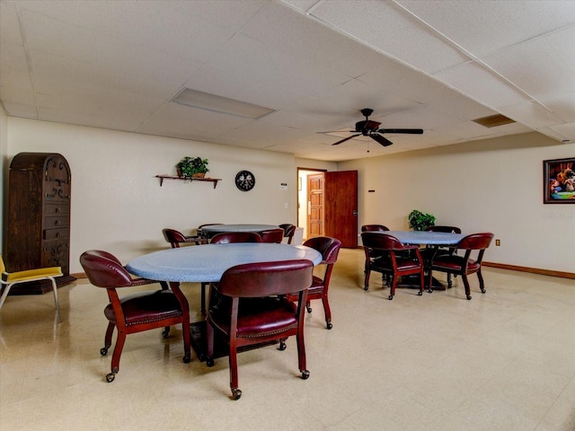 dining space featuring a paneled ceiling and ceiling fan