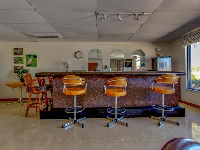 bar with a paneled ceiling