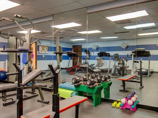 exercise room featuring a paneled ceiling