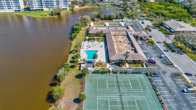 birds eye view of property with a water view