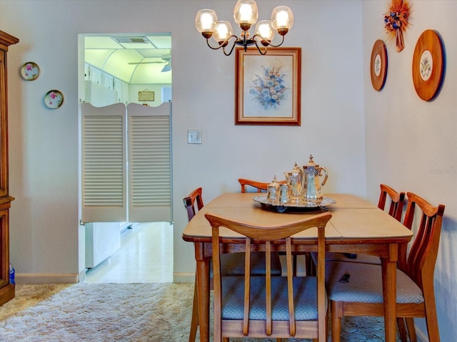 dining room with a notable chandelier