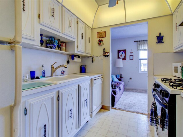 kitchen with white cabinetry, white appliances, sink, and light tile patterned floors