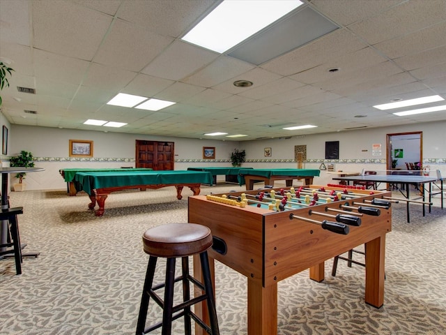 playroom featuring a drop ceiling and carpet floors