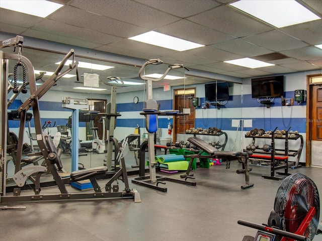 workout area with a paneled ceiling