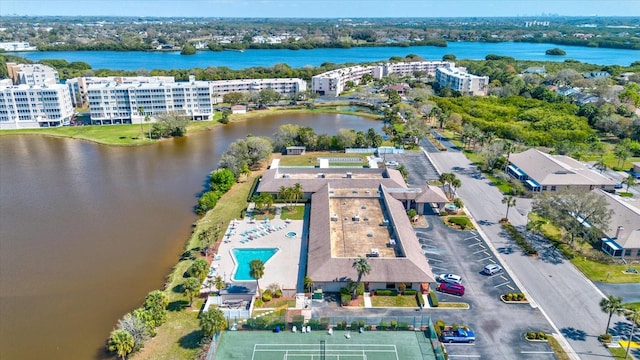 birds eye view of property with a water view