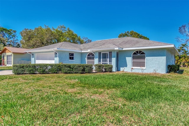 ranch-style home with a front lawn