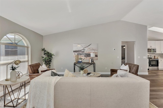 living room with lofted ceiling and dark hardwood / wood-style flooring