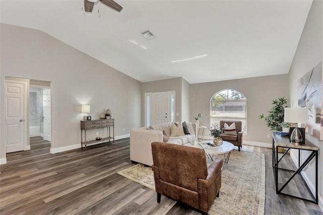 living room featuring lofted ceiling, ceiling fan, and dark hardwood / wood-style flooring