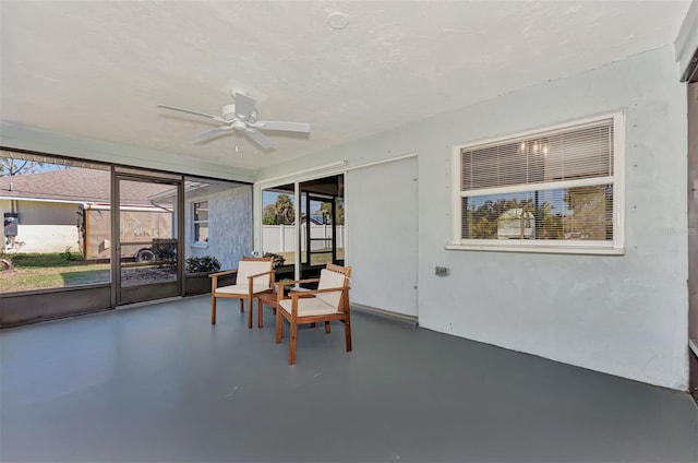 sunroom featuring plenty of natural light and ceiling fan