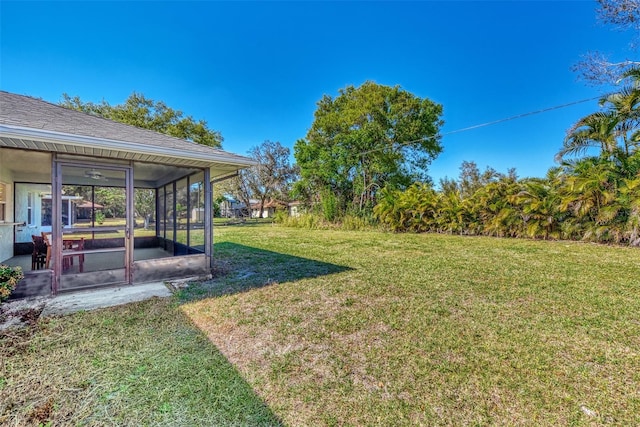 view of yard featuring a sunroom