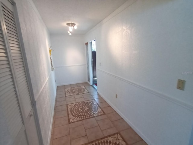 corridor with light tile patterned floors