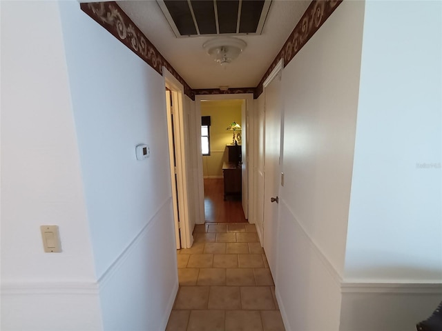 hall featuring tile patterned flooring