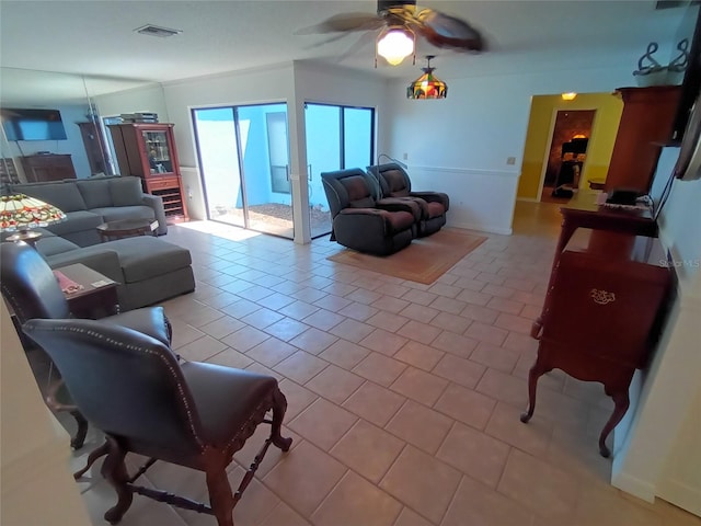 tiled living room featuring ceiling fan